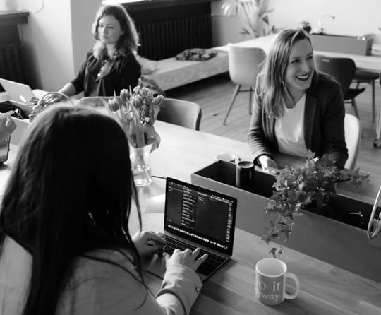 People working in an office workspace